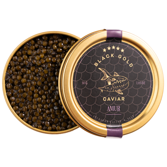 Open container of caviar with a decorative lid on a white background